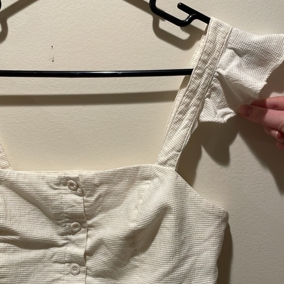 White Crop Top with Button-up Front and Ruffled Sleeve Caps - Picture 4 of 9